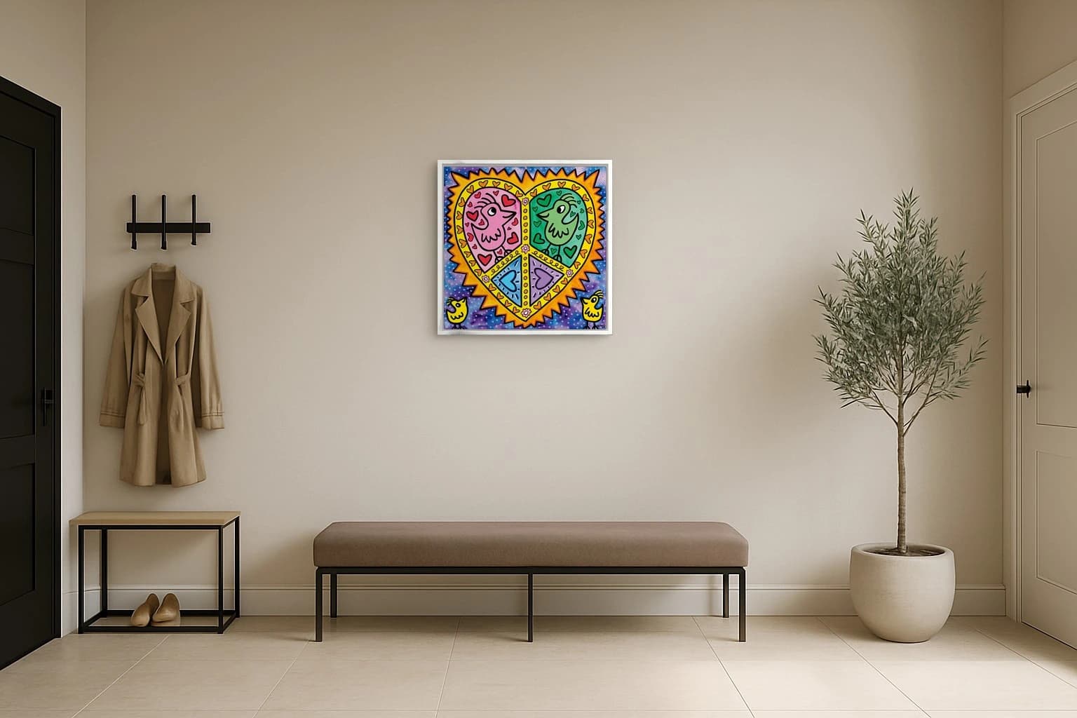 Buntes Herz mit zwei Vogelgesichtern, Herzen und Dekoformen auf blauem Punktmuster im weißen Rahmen, als Kunstwerk an der Wand eines hellen Raums.