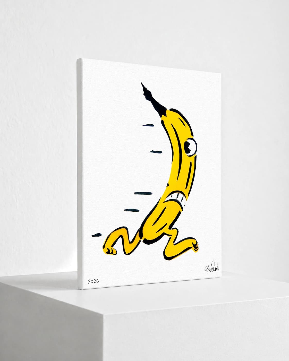 Gelbe Banane mit Auge und Gliedern auf weißem Hintergrund, unten links 2026 und Signatur.