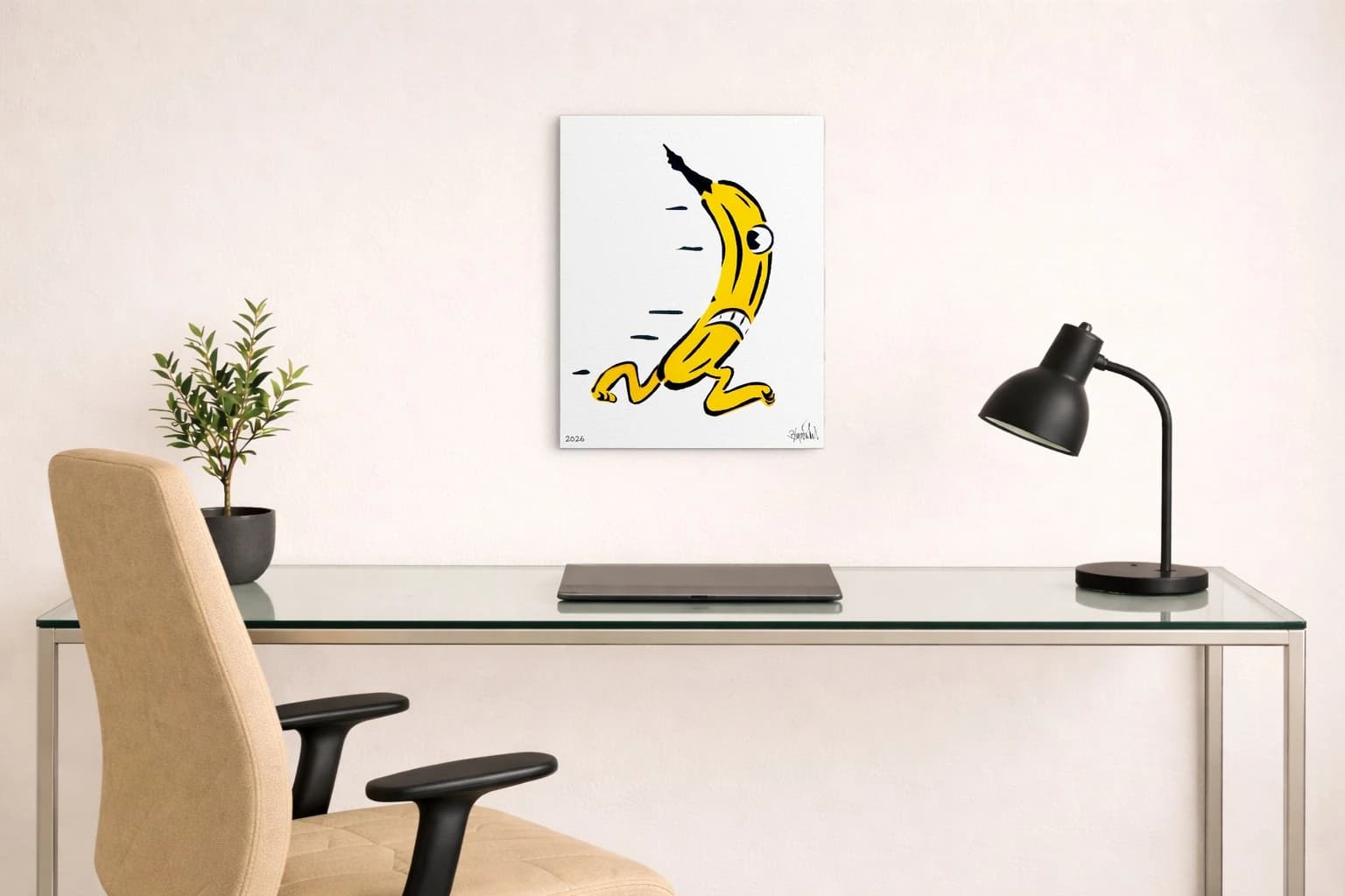 Gelbe Banane mit Auge und Gliedern auf weißem Hintergrund, unten links 2026 und Signatur, als Kunstwerk an der Wand eines Arbeitszimmers.