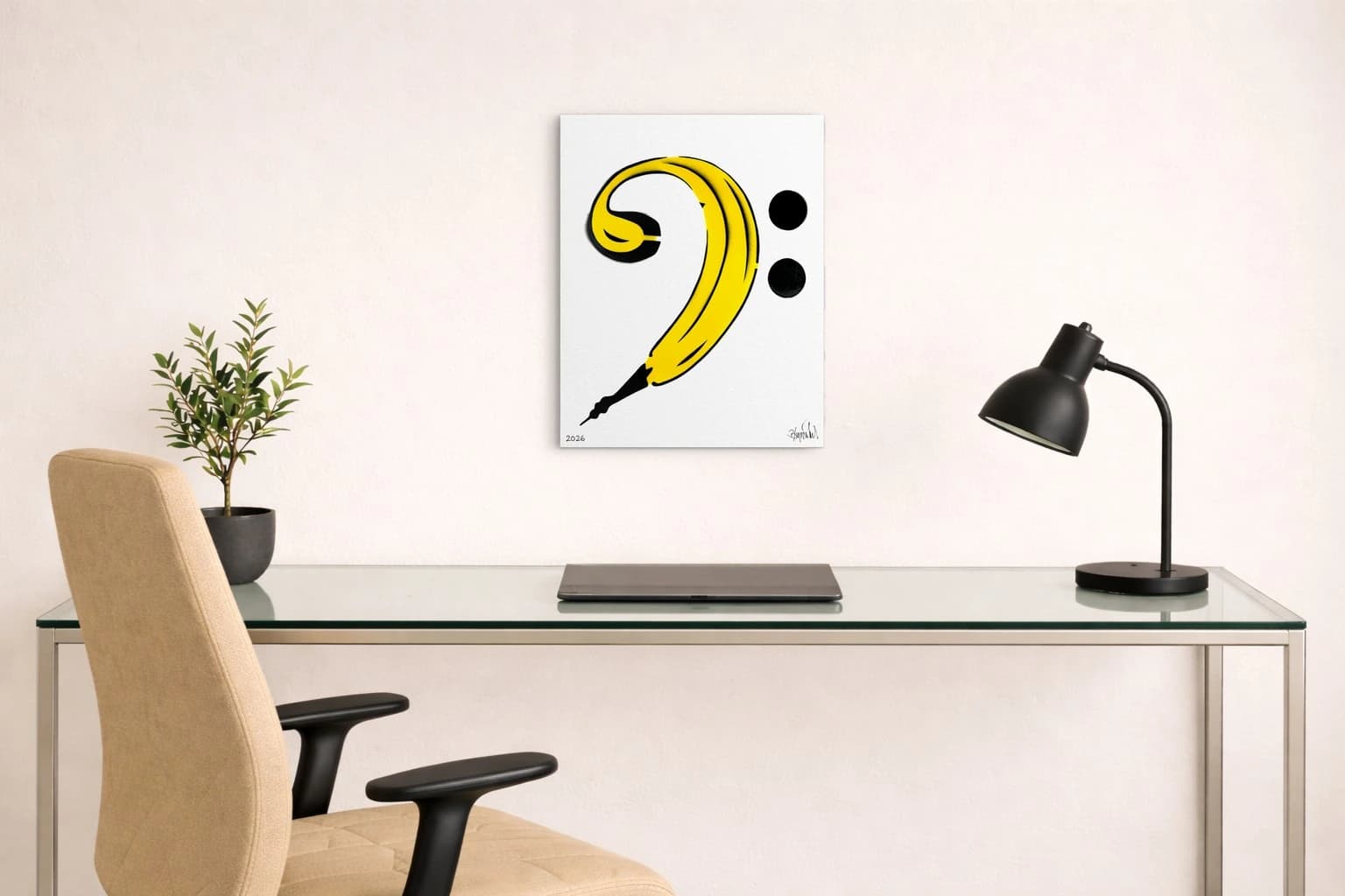 Gelbe Banane mit schwarzer Spitze, zwei schwarze Punkte und 2026, als Kunstwerk an der Wand eines Raums.