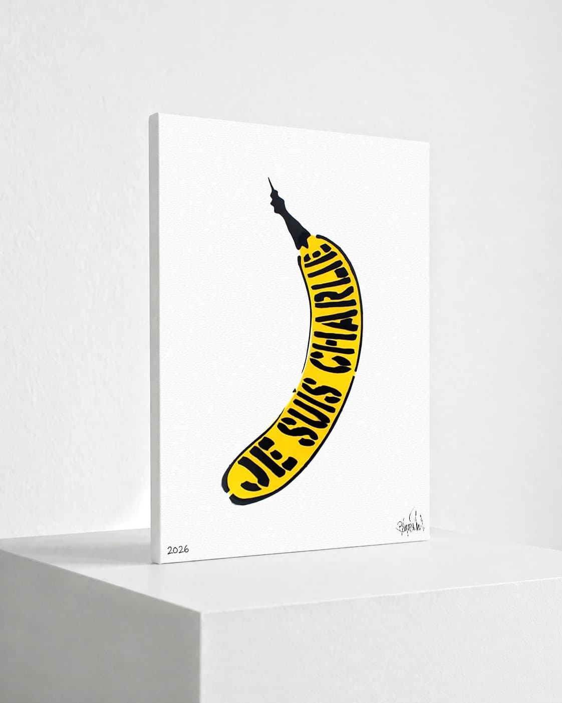 Gelbe Banane mit schwarzen Schriftzügen auf weißem Hintergrund, unten links 2026 und rechts eine Signatur.