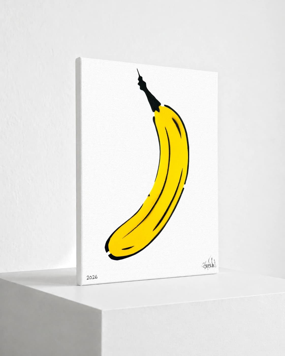 Gelbe Banane mit schwarzer Kontur auf weißem Hintergrund, unten links 2026 und Signatur unten rechts.