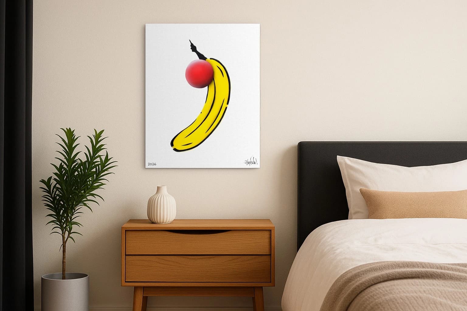 Gelbe Banane mit rotem Ball und schwarzem Stiel auf Weiß, unten Signatur und Jahr, als Kunstwerk an der Wand eines Schlafzimmers.