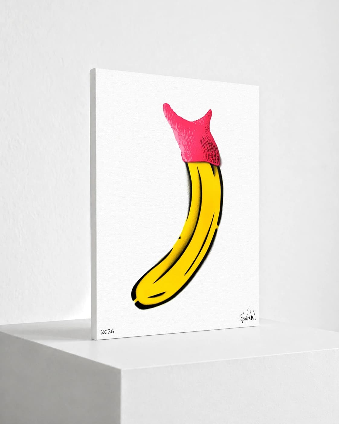 Gelbe Banane mit pinker Spitze auf weißem Hintergrund, unten links 2026 und rechts eine Signatur.