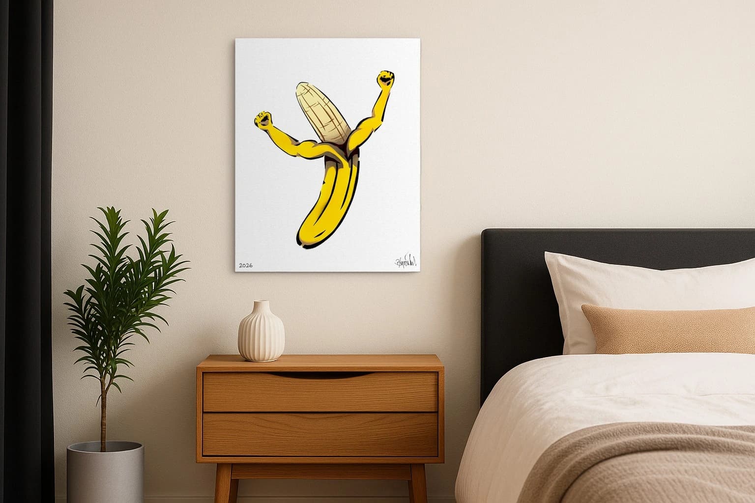Gelbe Banane mit zwei erhobenen Armen auf weißem Papier, als Kunstwerk an der Wand eines Schlafzimmers.